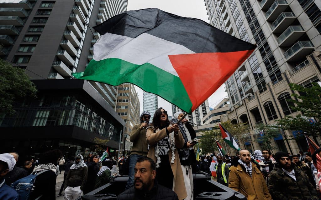 Anti-Israeli demonstrators wave Palestinian flags