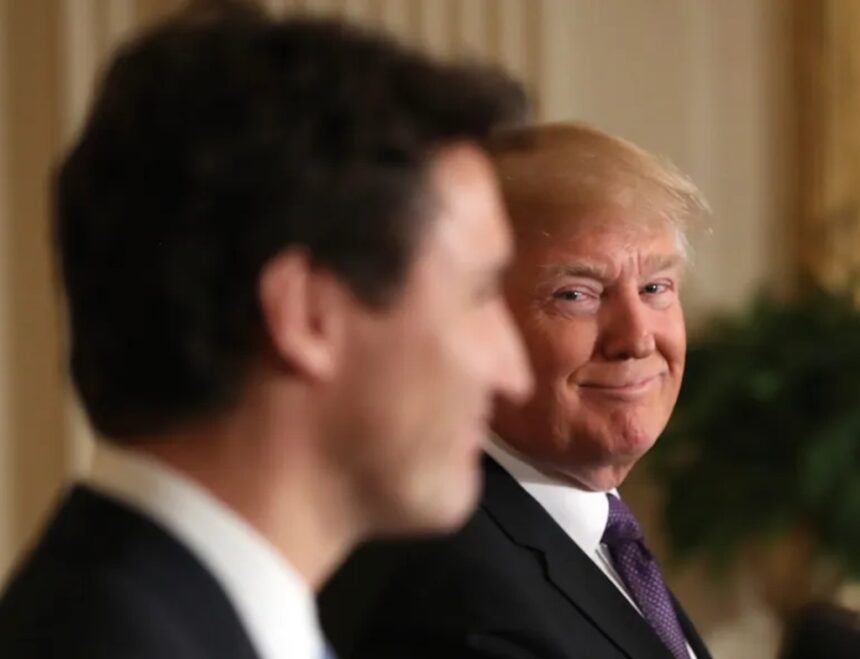 President Donald Trump smiles at Canadian Prime Minister Justin Trudeau